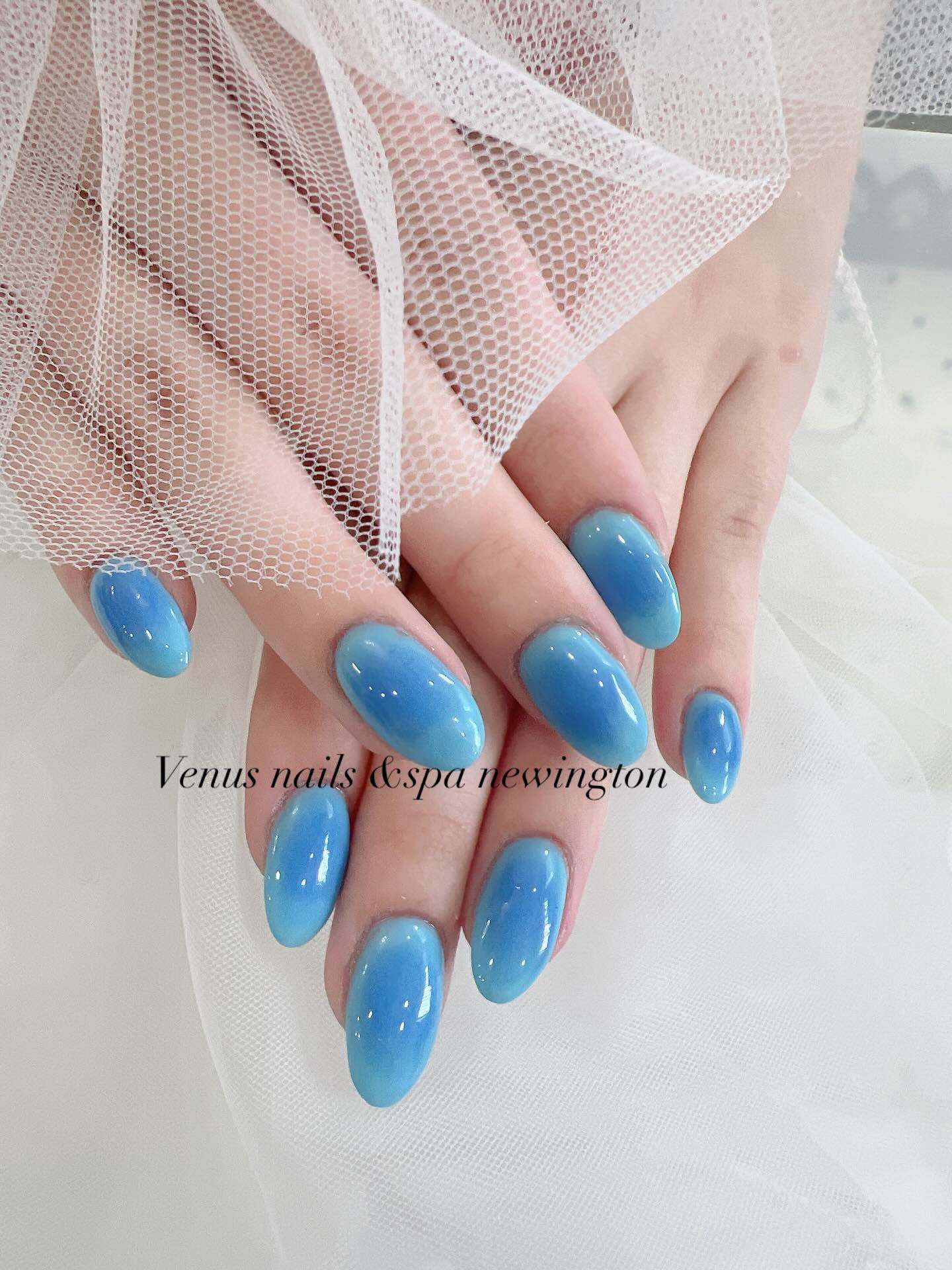 Sky blue ombre almond nails