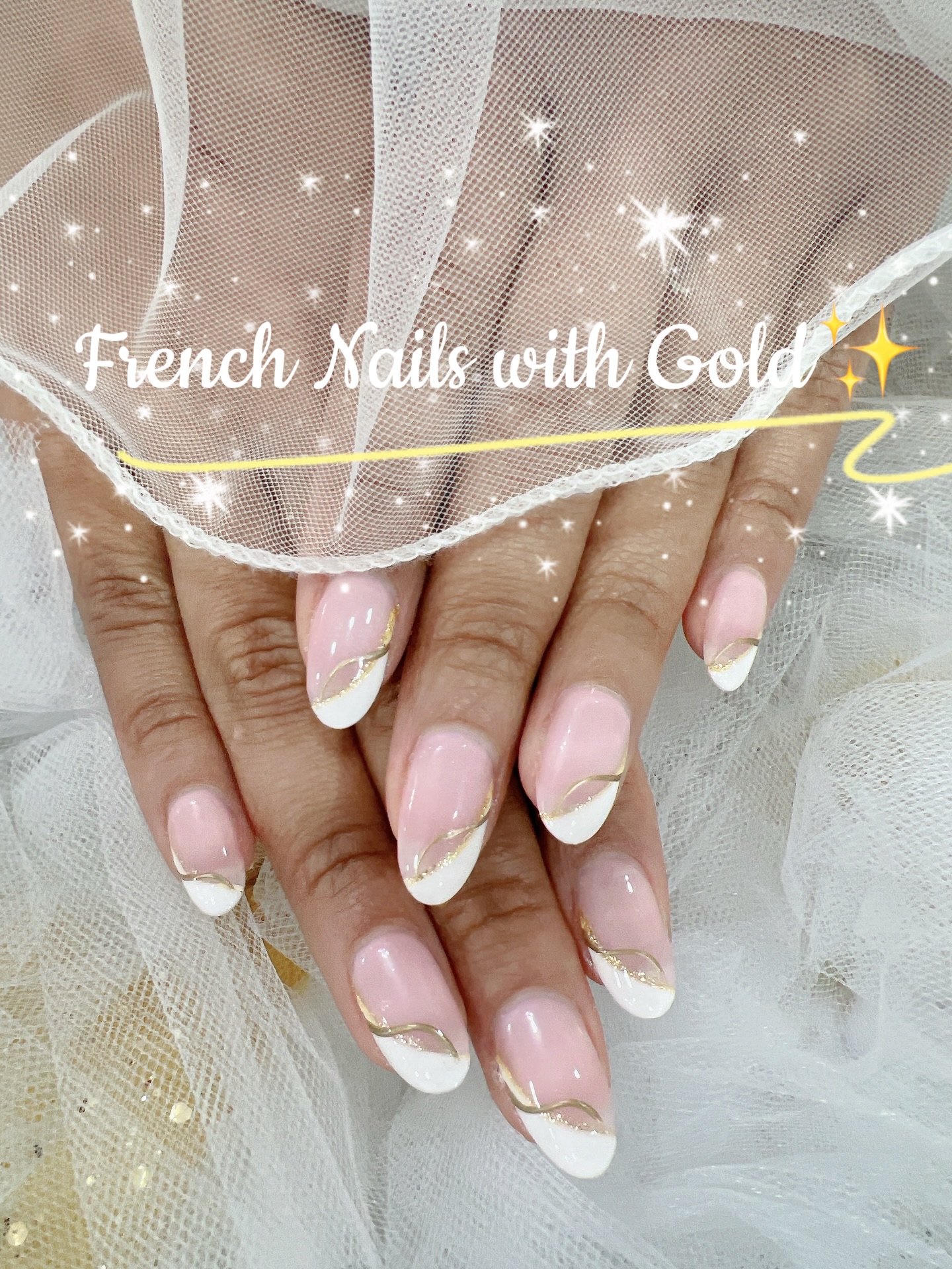French manicure with gold ribbon detail